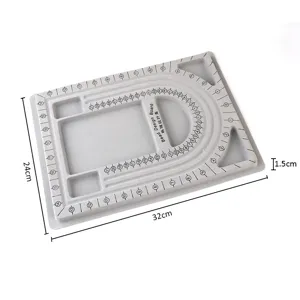 Grey flocked bead design board with measurement scales and compartments for DIY jewelry making.
