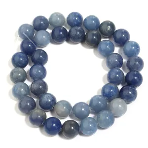 Close-up detail of smooth round blue aventurine loose beads, perfect for custom DIY jewelry making.