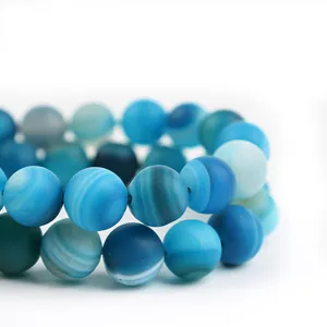 Perline rotonde in agata blu opaca naturale per la creazione di gioielli e accessori fai da te.