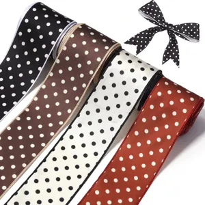 Polka dot ribbon roll and bow detail, perfect for DIY hair accessories, hats, and garment sewing crafts.