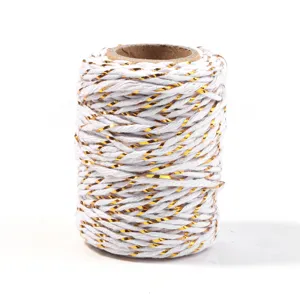 Close-up of white and gold metallic string, perfect for gift wrapping and DIY crafts.
