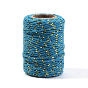 Detail view of blue and gold metallic twisted cotton cord for DIY crafts, gift packaging and decor.