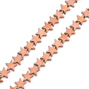 Close-up detail of copper electroplated star hematite loose beads for DIY jewelry making.