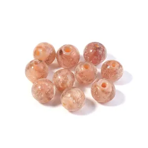 Pink gold foil glass beads detail, ideal for DIY handmade jewelry crafting and bracelet making.