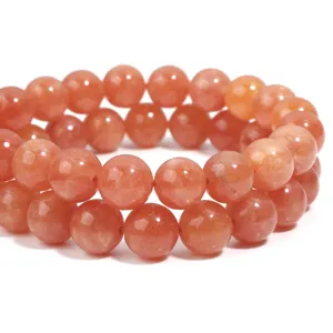 Natural orange sunstone round bead bracelet for DIY jewelry making and fashion accessories.