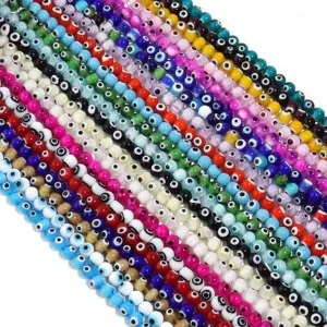Close-up detail of colorful glass evil eye beads strands, perfect for DIY jewelry making.