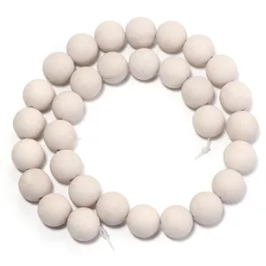 Natural white fossil stone round beads detail shot for DIY jewelry making and bracelet accessories.