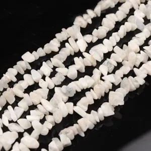Detailed view of irregular white crystal stone chip bead strands for DIY jewelry making.