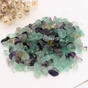 Detailed close-up view of irregular natural fluorite chip beads, perfect for DIY jewelry crafting.