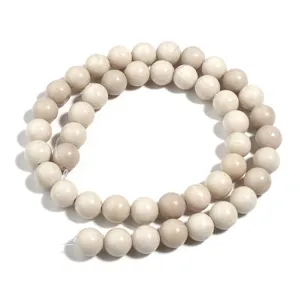 Natural white fossil round beads strand for DIY jewelry making, elegant minimalist design.
