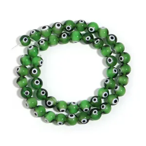 Green evil eye glass beads detail shot, perfect for DIY handmade bracelets and necklaces accessories.