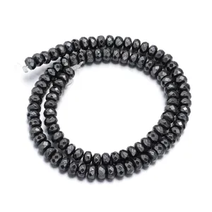 Faceted black hematite abacus beads close-up detail shot, perfect for DIY jewelry making.