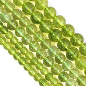 Green crystal gemstone bead detail close-up, loose beads for DIY jewelry bracelet crafts.