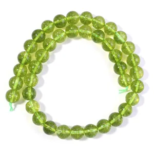 Close-up detail of green crystal loose beads, perfect for DIY handmade beaded bracelets.