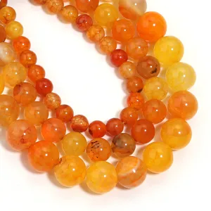 Vista dettagliata di perline in agata bicolore fiamma naturale, perfette per gioielli DIY fatti a mano.