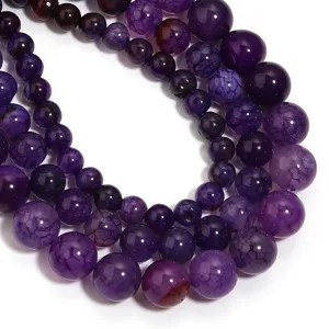 Perline tonde sciolte in agata viola primo piano accessori per gioielli fai da te dettagli