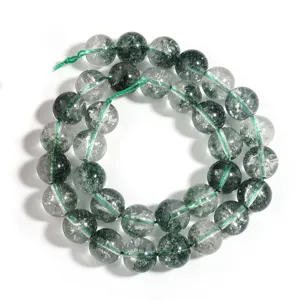 Close-up detail of green phantom crystal loose beads, crackle crystal texture for DIY jewelry making