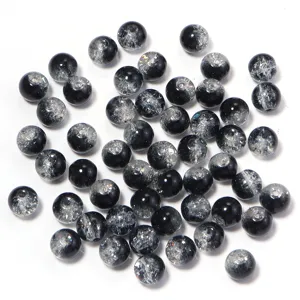 Closeup of black and silver crackle glass beads detail for DIY jewelry making crafts.