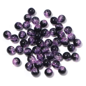 Close up details of purple and black crackle glass beads for DIY jewelry making and accessories.