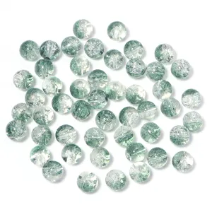 Close-up of green crackle glass beads, perfect for DIY handmade jewelry and craft accessories.
