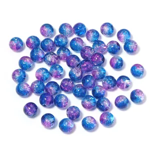 Close-up detail of blue and purple crackle glass beads for DIY jewelry making accessories.