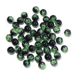 Two-color crackle glass beads detail showing unique texture and green black beads.