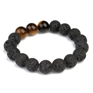 Close-up details of black lava stone and tiger eye beads bracelet, natural texture and glossy finish.