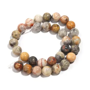 Detailed close-up of colorful natural crazy lace agate round gemstone beads for DIY jewelry.