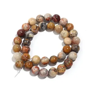 Natural crazy lace agate gemstone round beads detail shot showing colorful patterns.