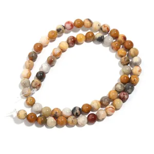 Detailed view of natural crazy lace agate round gemstone beads strand for DIY jewelry making.