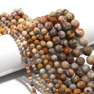 Closeup view of natural crazy lace agate round beads strands, perfect for DIY jewelry making.