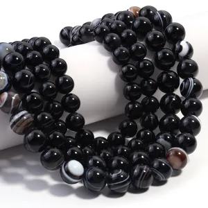 Perline di agata nera striata perle tonde in pietra naturale per creazione di gioielli.
