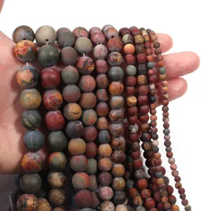 Close-up of matte Picasso jasper stone beads strands, showing detailed texture and natural color.