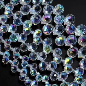 Detailed view of AB coated faceted teardrop crystal beads for DIY jewelry making and craft accessories.