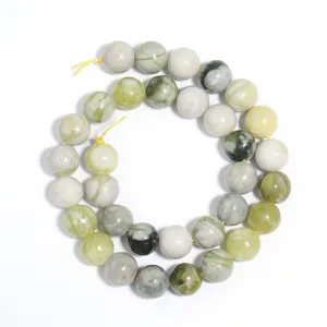 Natural green jade round beads strand for DIY jewelry making, smooth gemstone accessory detail.
