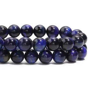 Detail de perles en oeil de tigre bleu, perles rondes en vrac pour la creation de bijoux.
