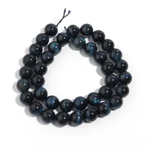 Detail view of deep blue tiger eye gemstone round beads strand for DIY jewelry making
