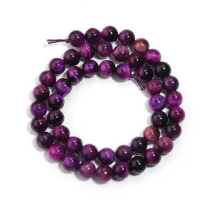 Natürliche lila Tigerauge Edelstein runde lose Perlen Detailaufnahme für DIY Schmuck.