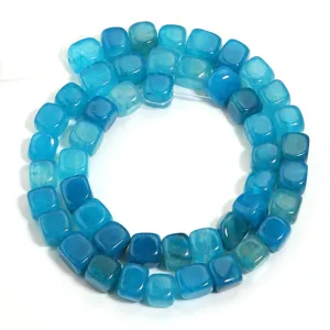 Close-up detail of blue cube agate stone beads, perfect for DIY jewelry crafting.