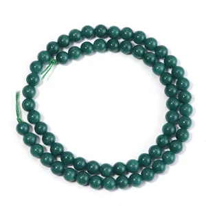 Detailed view of dark green chalcedony stone beads arranged in a loop for DIY jewelry crafting.