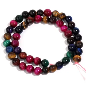 Close-up detail of multicolored tiger eye gemstone round beads for DIY handmade jewelry crafting.