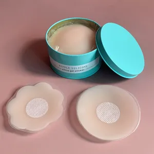 Set de cache-tétons en silicone dans une boîte ronde bleue, texture lisse et discrète.
