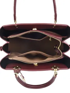 Burgundy women handbag interior view, large capacity structured tote shoulder bag stylish.