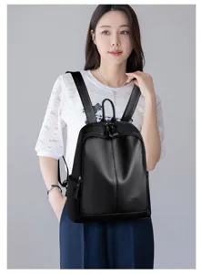 Stylish women's black PU leather backpack, soft texture, large capacity casual travel bag.