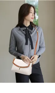 Chic women's crossbody bag with soft leather, contrast brown flap and metal lock detail for daily use.