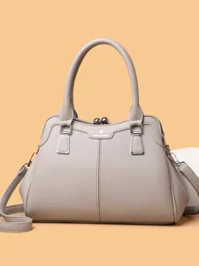 Elegant women's taupe leather handbag with kiss-lock closure and shoulder strap main view.