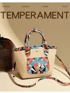 Detailed view of the woven straw bucket bag featuring a colorful opera mask patch and straps.