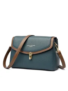 Elegant soft leather shoulder bag for women with chic contrast trim and metallic lock closure.