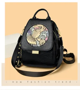 Black leather backpack with stylish embossed elephant pattern, spacious travel daypack for women