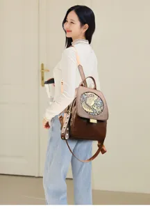 Detailed view of women's vintage embossed leather backpack, stylish and functional.